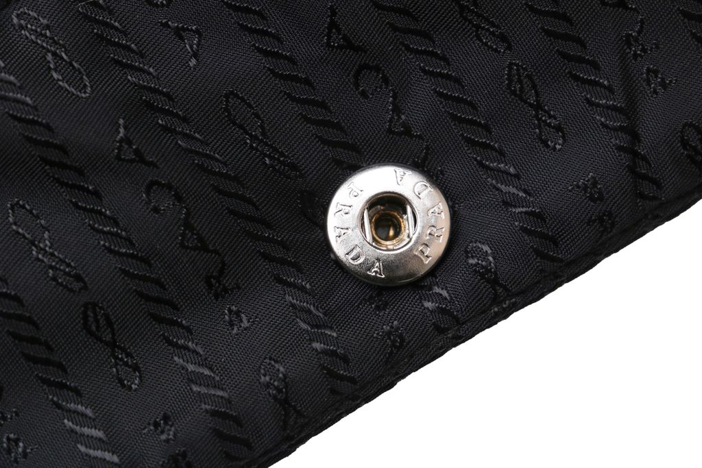 Prada triangle badge jacquard padded jacket recycled nylon logo fabric high density rayon lining 80g insulation custom hardware oversized fit sizes S-XL