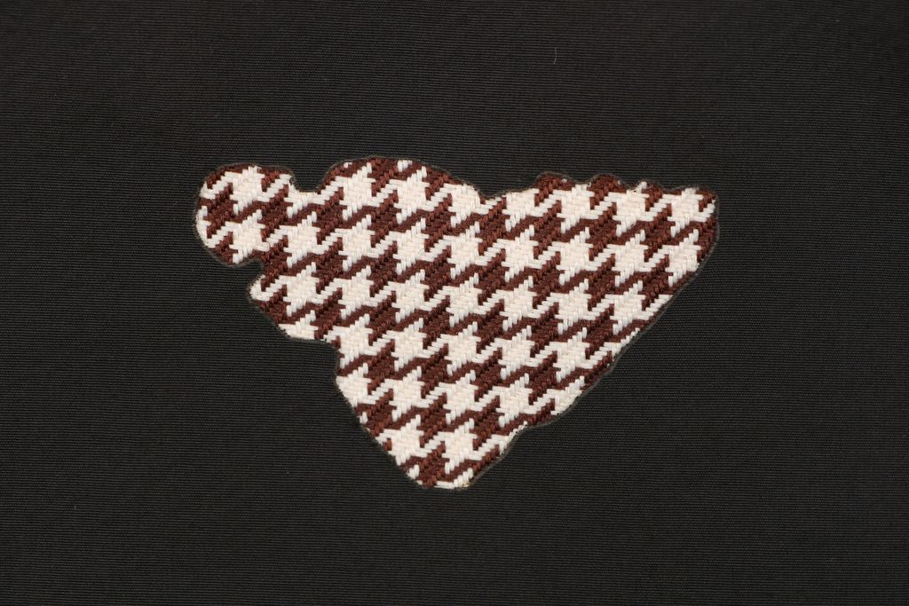 Prada burnout houndstooth patchwork jacket black 100 percent cotton full houndstooth lining triangle badge metal zip cropped relaxed unisex fit sizes S-XL