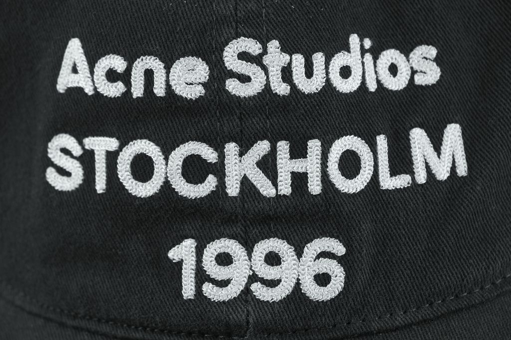 Acne Studios 1996 logo washed cap 300gsm 100 percent combed cotton twill vintage faded black stone enzyme wash embroidered logo aged brass buckle 60cm