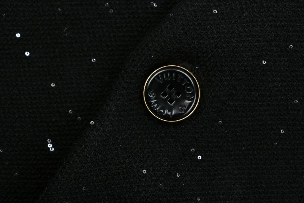 Louis Vuitton black starry sequin knit V-neck cardigan integrated sequin yarn subtle sparkle custom buttons dual patch pockets tonal embroidery relaxed fit sizes S-XL