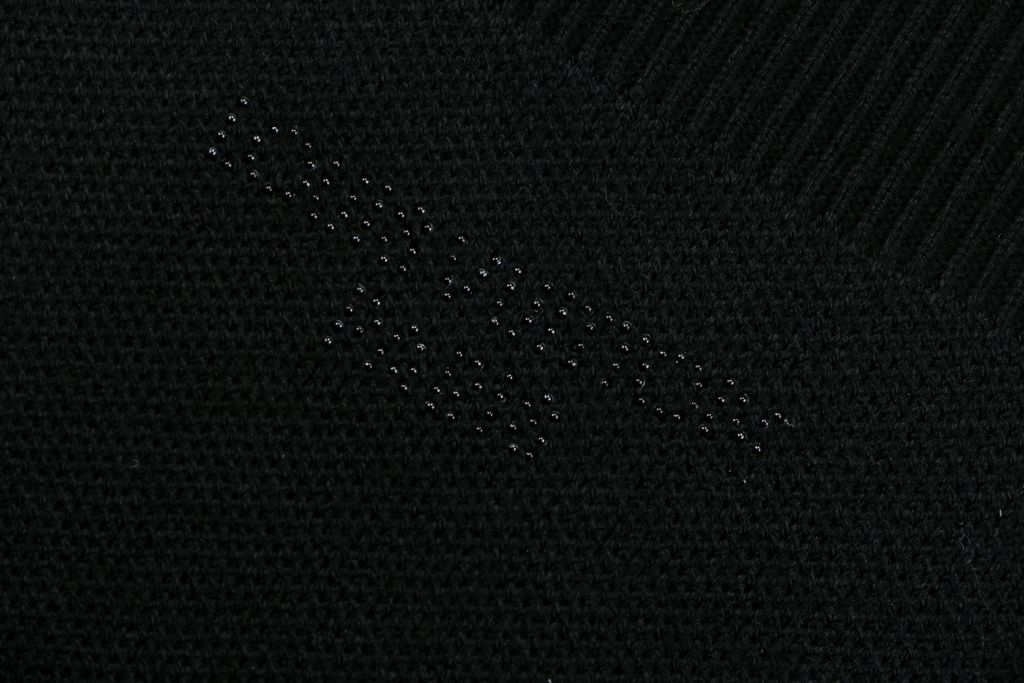 Louis Vuitton black starry sequin knit V-neck cardigan integrated sequin yarn subtle sparkle custom buttons dual patch pockets tonal embroidery relaxed fit sizes S-XL