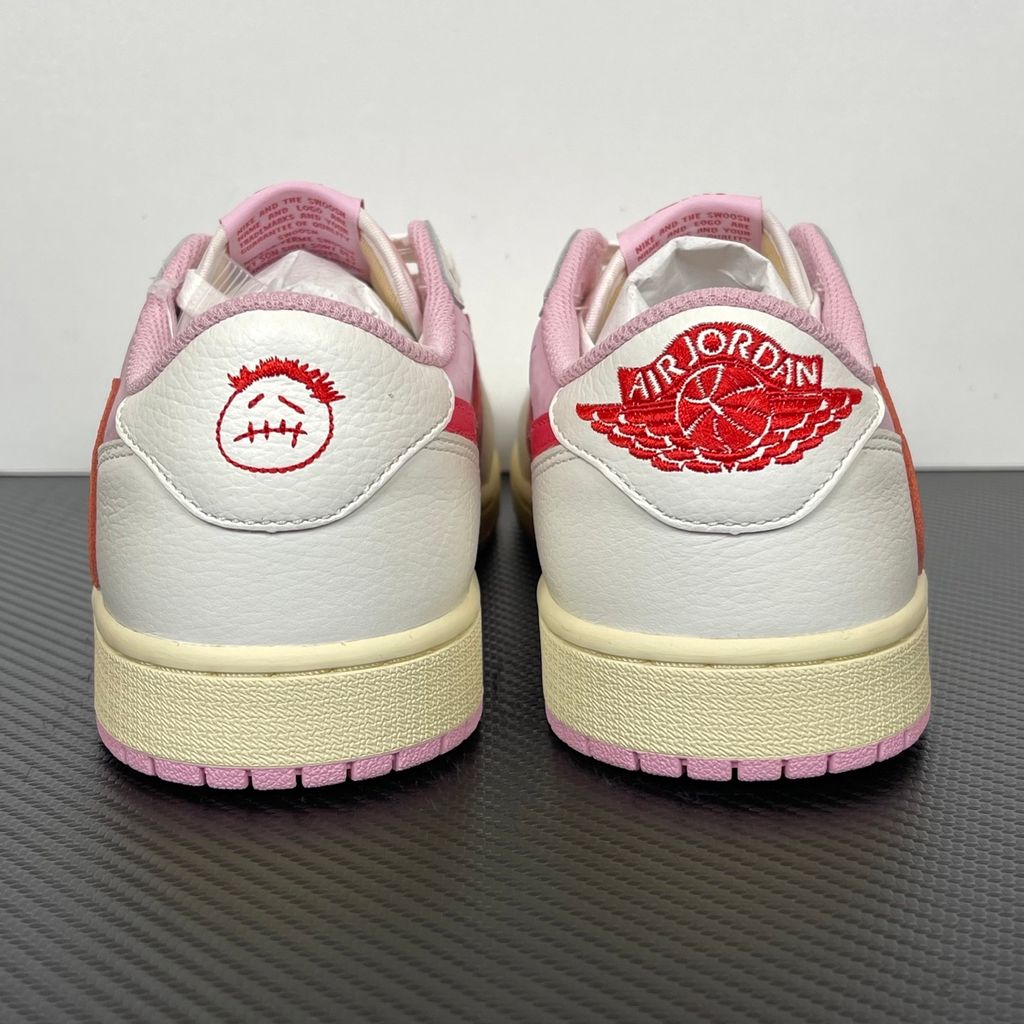Travis Scott Air Jordan 1 Low OG IQ7604-101 Shy Pink and Sail colorway with reverse red swoosh and Cactus Jack heel logo