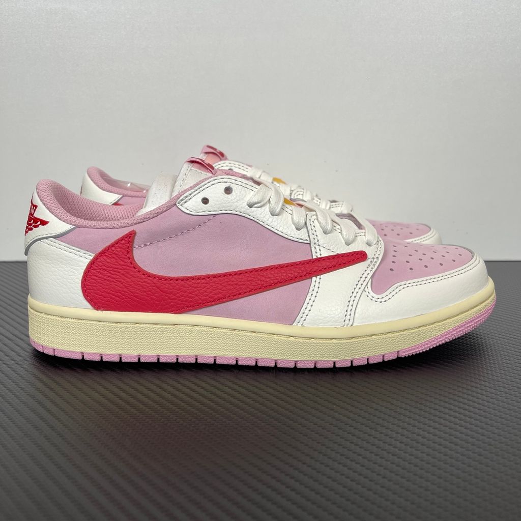 Travis Scott Air Jordan 1 Low OG IQ7604-101 Shy Pink and Sail colorway with reverse red swoosh and Cactus Jack heel logo.