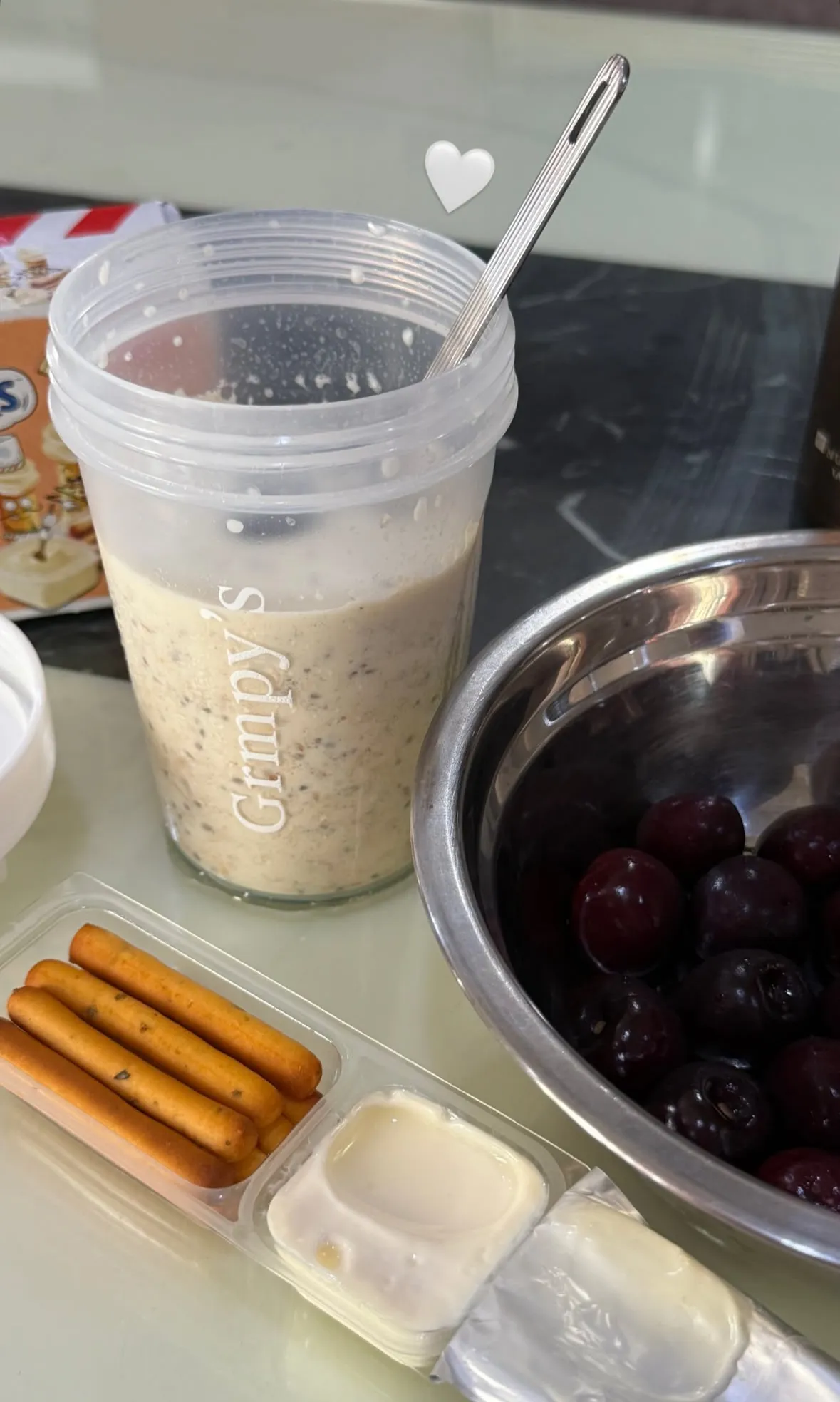 A bowl of cherries and a container of milkAI-generated content may be incorrect.