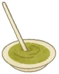 A bowl of hay powder puree with a spoon