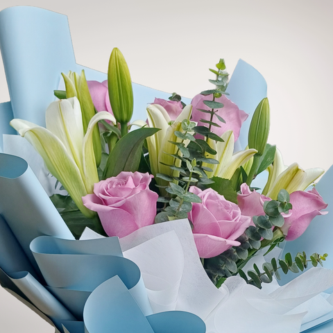 Soft Serenade lilies, rose and eucalyptus hand bouquet for birthday or anniversary with delivery in Kuala Lumpur and Selangor
