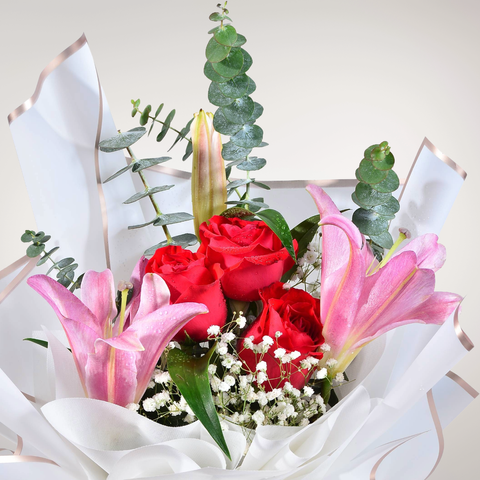 Sunset Kiss lily, rose and baby’s breath hand bouquet for birthday or anniversary with delivery in Kuala Lumpur and Selangor