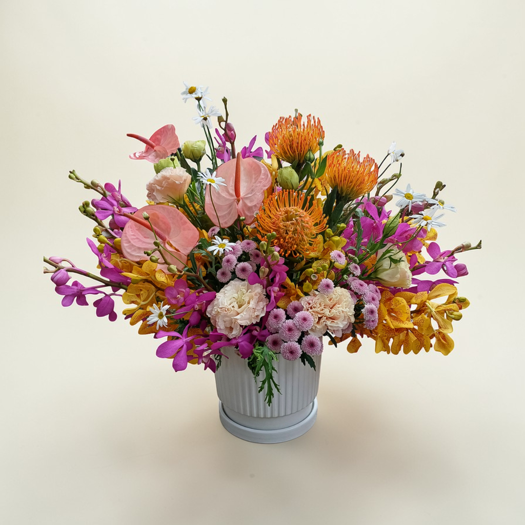 Tranquil Petals pin cushion protea and orchid table arrangement for birthday or anniversary with delivery in Kuala Lumpur and Selangor