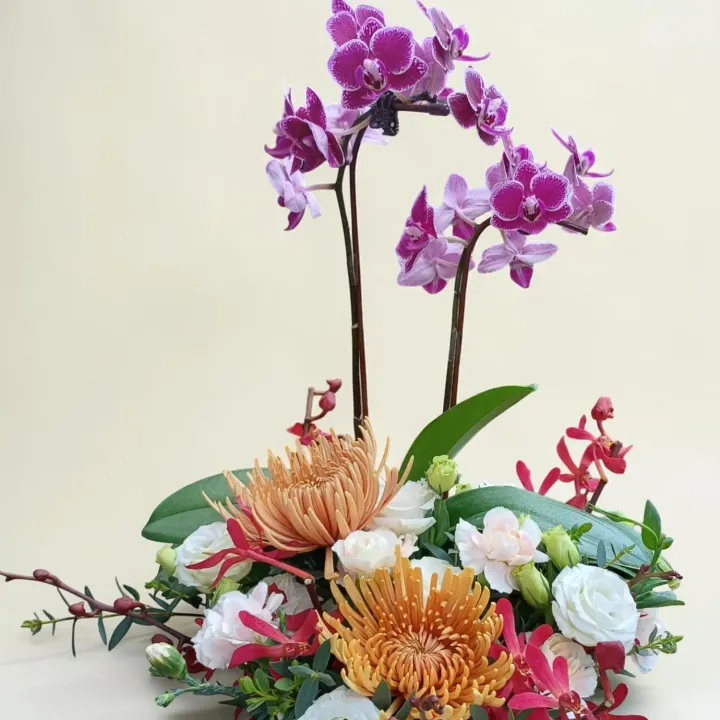 Floral Charm phalaenopsis orchid, chrysanthemum and eustoma table arrangement for birthday or anniversary with delivery in Kuala Lumpur and Selangor