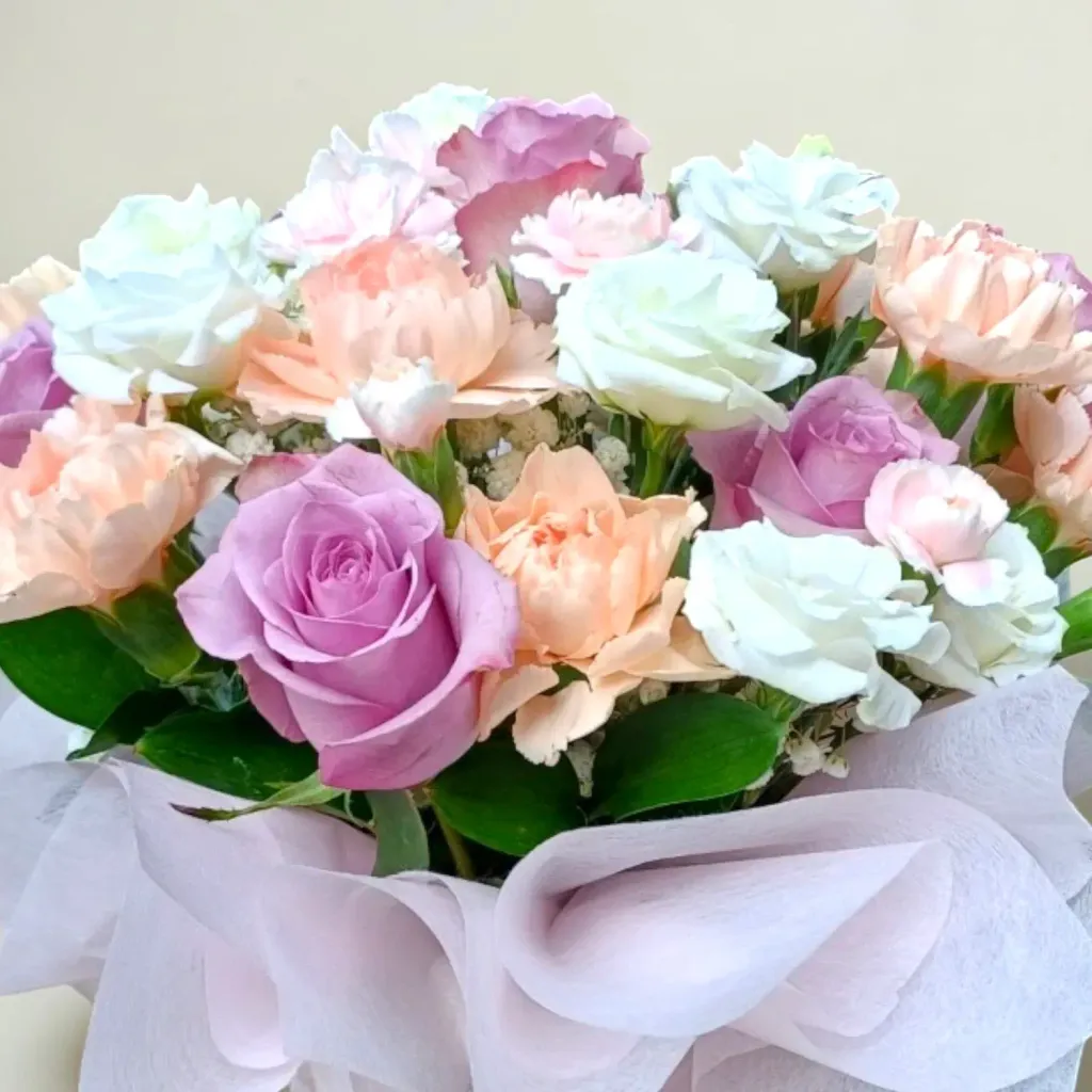Delicate Romance roses, carnations, eustomas and spray carnations table arrangement for Mother's Day or birthday with delivery in Kuala Lumpur and Selangor