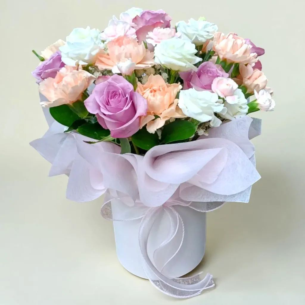 Delicate Romance roses, carnations, eustomas and spray carnations table arrangement for Mother's Day or birthday with delivery in Kuala Lumpur and Selangor
