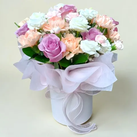 Delicate Romance roses, carnations, eustomas and spray carnations table arrangement for Mother's Day or birthday with delivery in Kuala Lumpur and Selangor