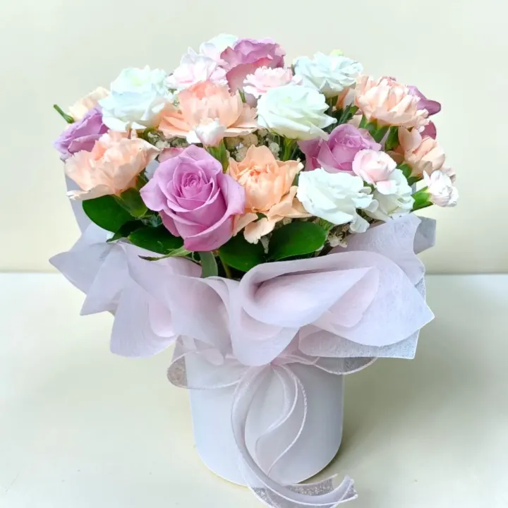 Delicate Romance roses, carnations, eustomas and spray carnations table arrangement for Mother's Day or birthday with delivery in Kuala Lumpur and Selangor