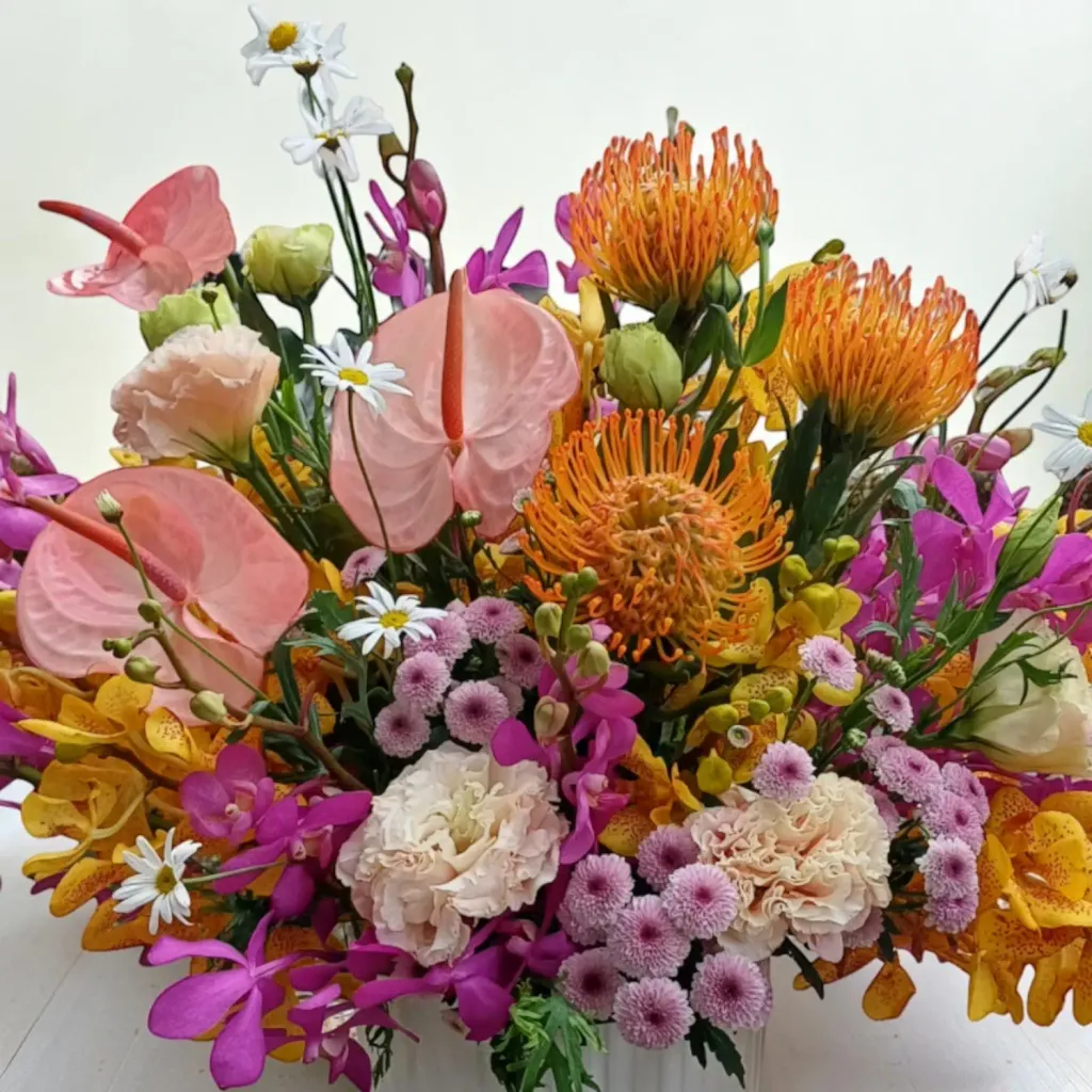 Tranquil Petals pin cushion protea and orchid table arrangement for birthday or anniversary with delivery in Kuala Lumpur and Selangor