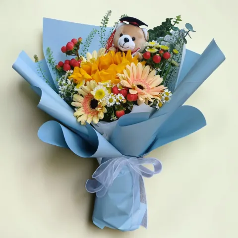 Petal Essence sunflower, gerberas, chamomile, berries and graduation bear flower bouquet for graduation with delivery across KL & Selangor