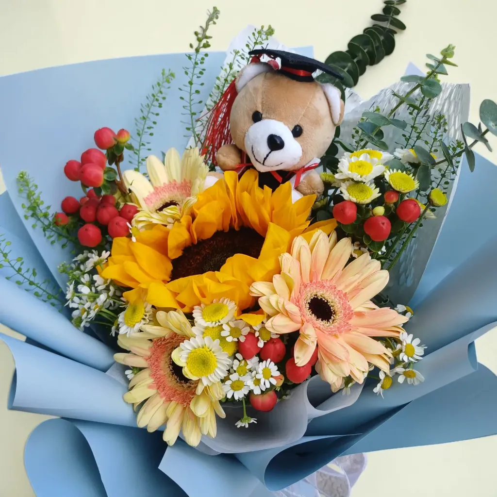Petal Essence sunflower, gerberas, chamomile, berries and graduation bear flower bouquet for graduation with delivery across KL & Selangor