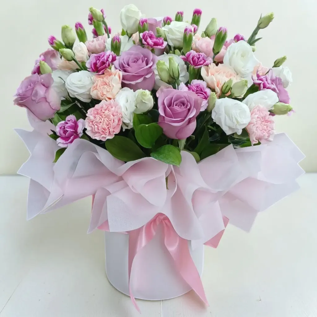 Delicate Romance roses, carnations, eustomas and spray carnations table arrangement for Mother's Day or birthday with delivery in Kuala Lumpur and Selangor