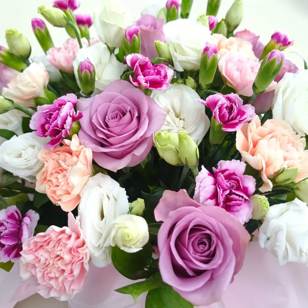 Delicate Romance roses, carnations, eustomas and spray carnations table arrangement for Mother's Day or birthday with delivery in Kuala Lumpur and Selangor