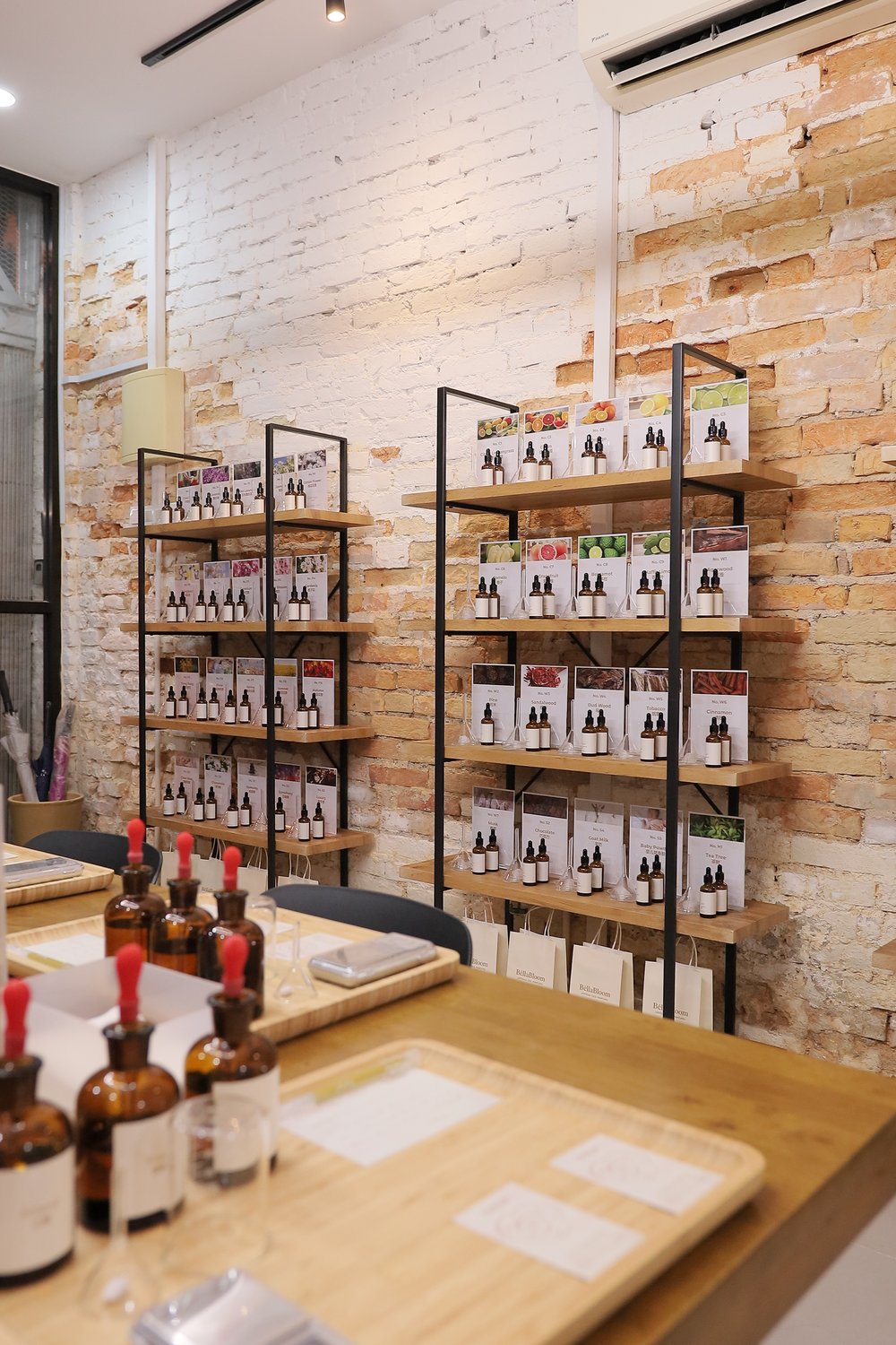 Perfume workshop tables and scent shelves inside BéllaBloom in Melaka