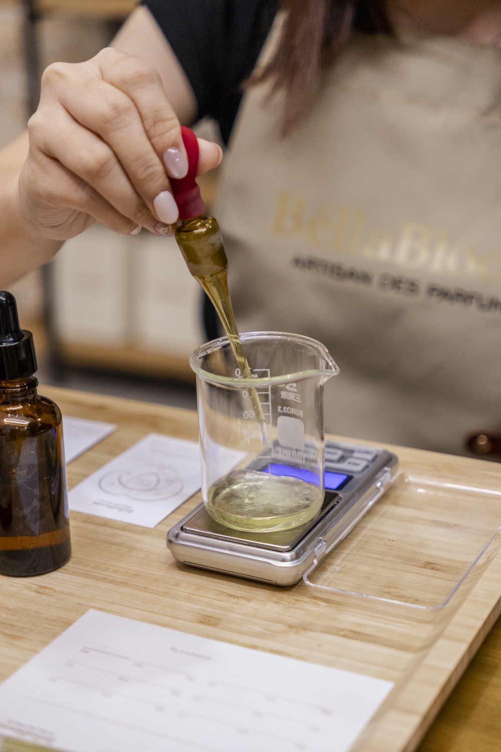 Creating perfume with a dropper at BéllaBloom's DIY workshop