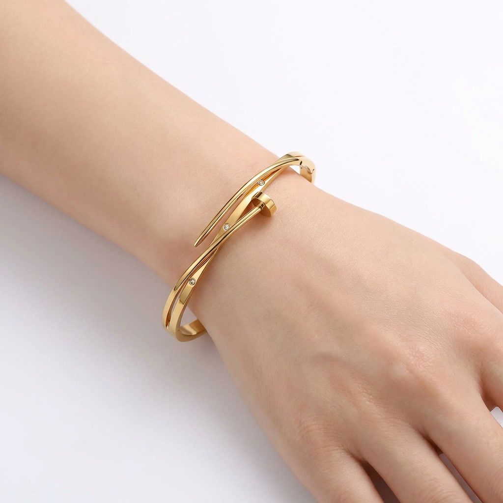 gemini-image-2_45-degree_angle_with_model_hand_Prompt_A_high-end_product_shot_of_the_gold_bangl-0