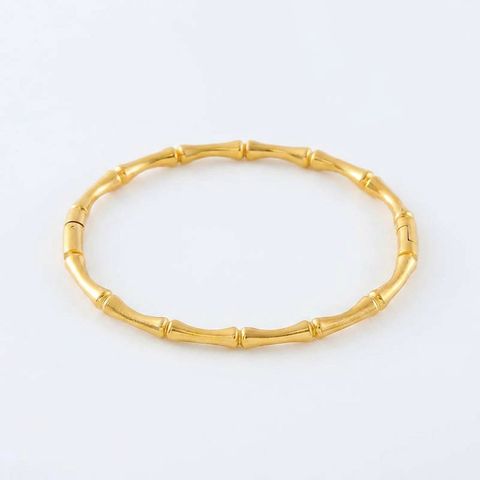 gemini-image-2_Second_Photo_close-up_product_only_Prompt_A_close-up_shot_of_the_gold_bamboo_bra-0