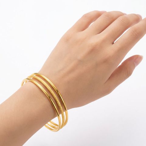 gemini-image-2_First_Photo_with_model_hand_wearing_the_bangles_Prompt_Close-up_shot_of_three_go-0