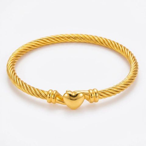 gemini-image-2_Second_Photo_close-up_product_only_Prompt_A_close-up_shot_of_the_gold_twisted_ro-0