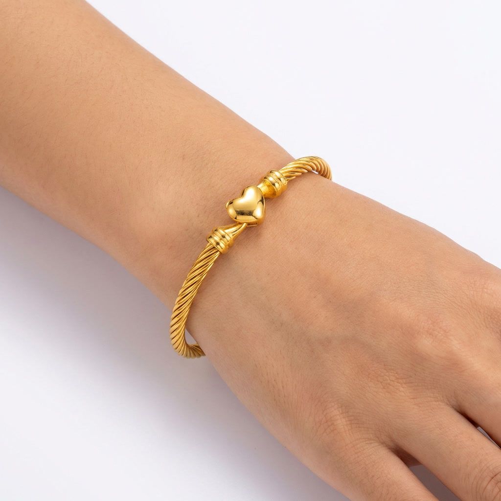 gemini-image-2_First_Photo_worn_on_model_s_hand_one_wrist_Prompt_Close-up_shot_of_a_gold_twiste-0