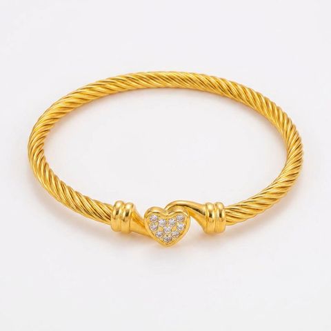 gemini-image-2_Second_Photo_close-up_product_only_Prompt_A_close-up_shot_of_the_gold_twisted_ro-0 (1)