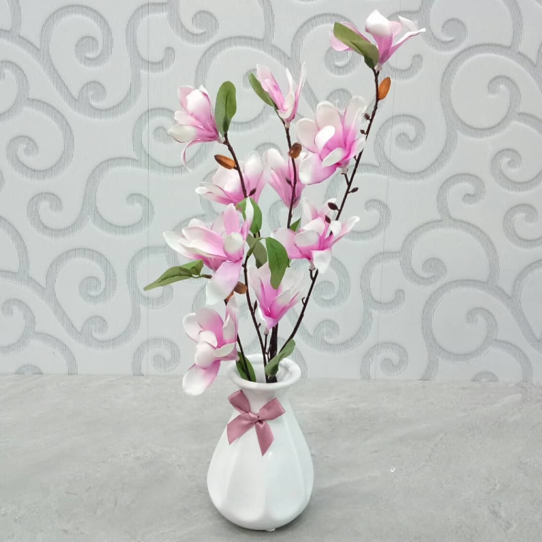 pink artificial flowers in vase