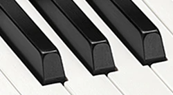 Simulated ebony and ivory keys with optimal fingertip fit for playing ease