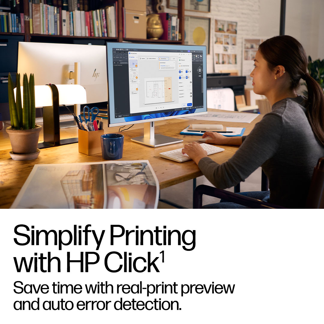 Architects and engineers reviewing a large-format print to expand into other applications.