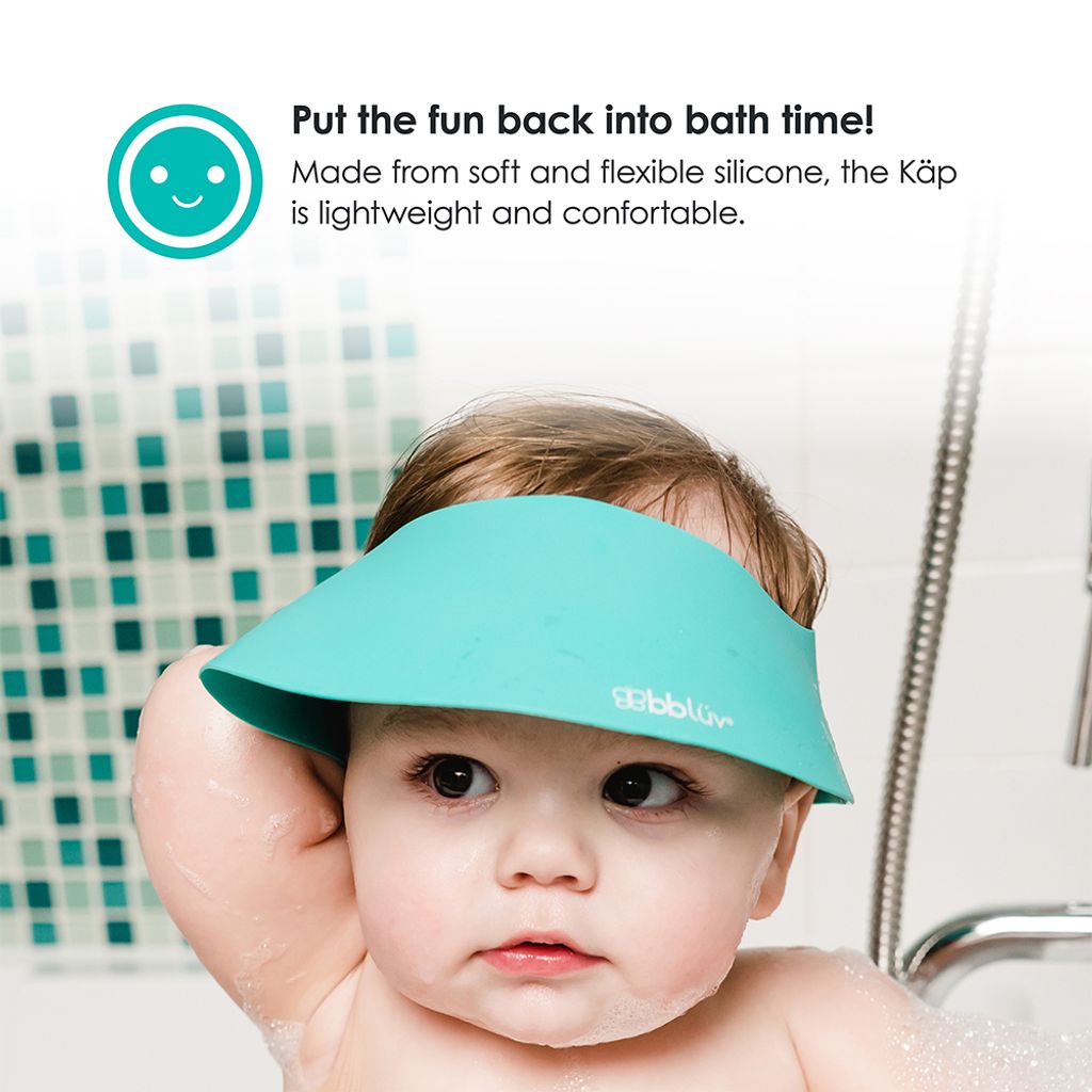 B0109_-_KAP_-_Feature_-_Baby_on_bath_tub_with_cap_on_head