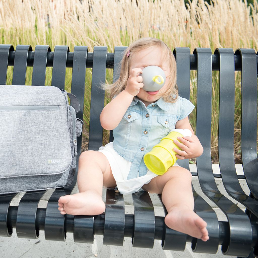 B0115_-_Dose_-_Lifestyle_-_Girl_drinking_out_from_cap_sitting_on_bench_-_square_format