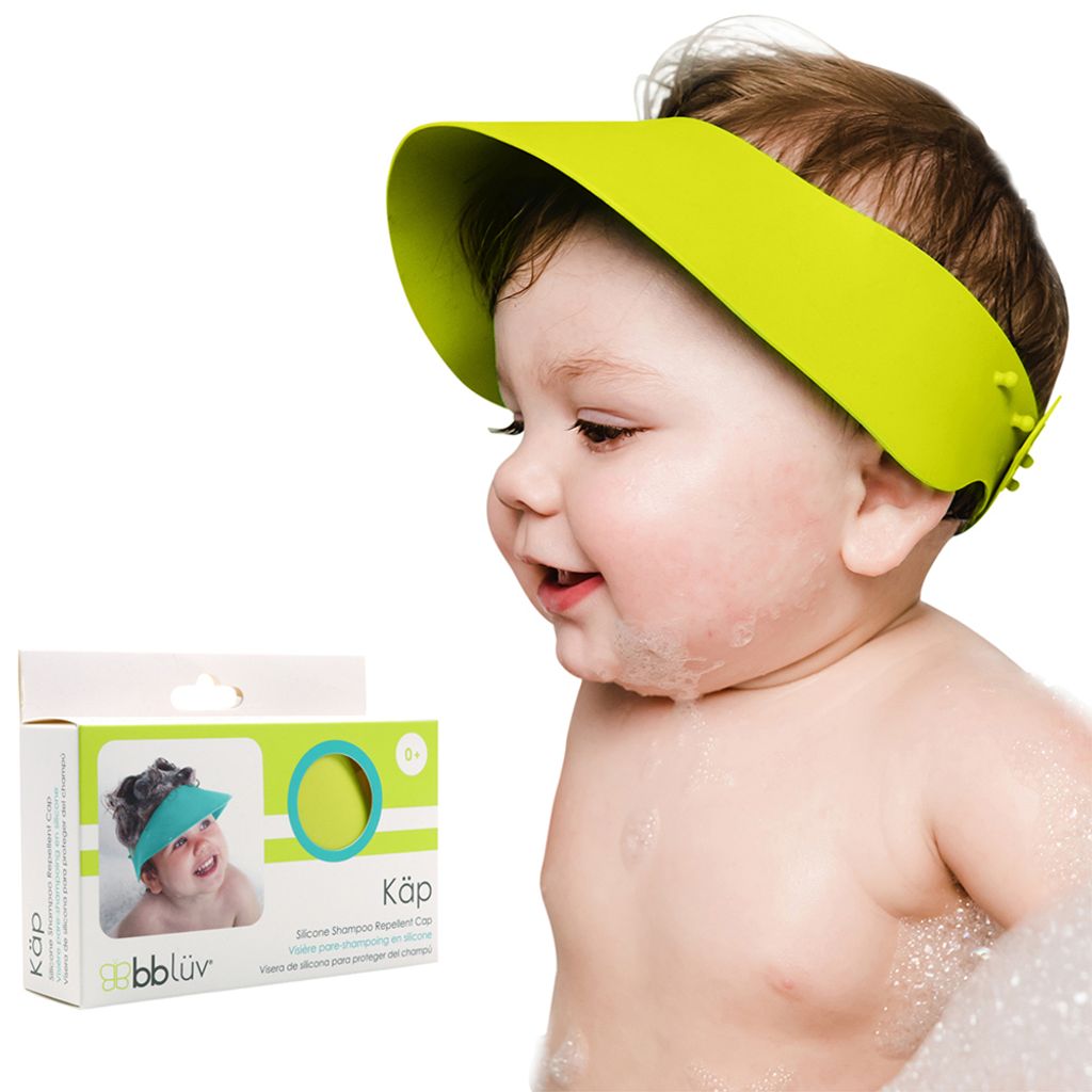 B0109L_-_KAP_-_Feature_-_Baby_smiling_with_cap_on_head_-_Package_on_side_-_Three_Languages