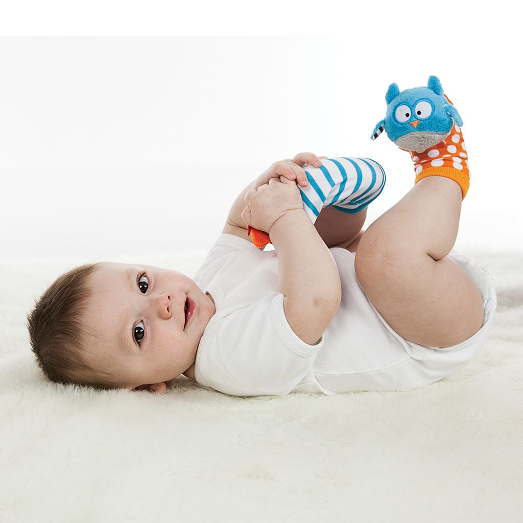 B0104_-_DUO_-_Fox_and_Owl_-_Lifestyle_-_Baby_on_side_looking_at_camera_-_Holding_feet-_Lying_on_back_-_Wearing_both_socks_-_Landscape_Format