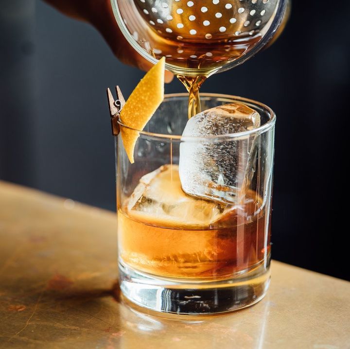 closeup-glass-with-alcohol-in-cocktail-bar-royalty-free-image-1581695686.jpg