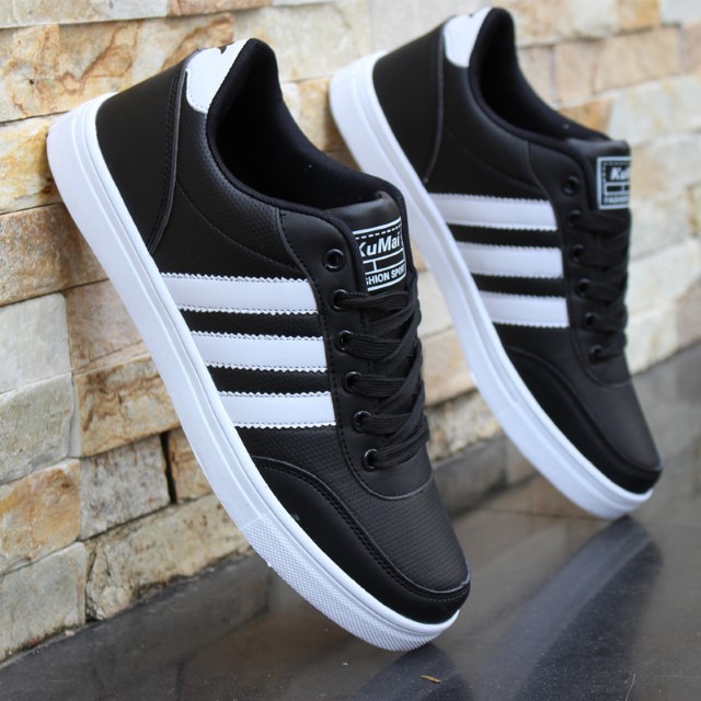 white shoes with three black stripes