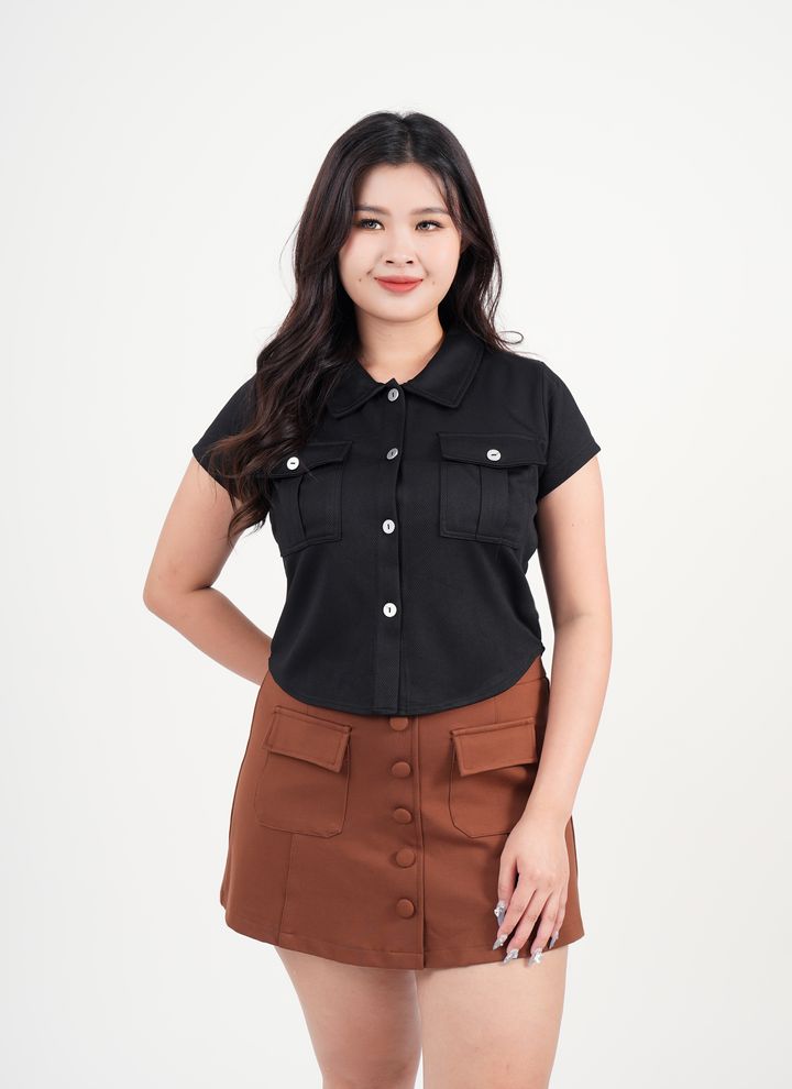 Plus size jacquard knit top with structured collar and front buttons.