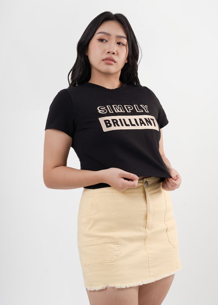 Short-sleeve classic top in soft blue, featuring bold text across the chest.