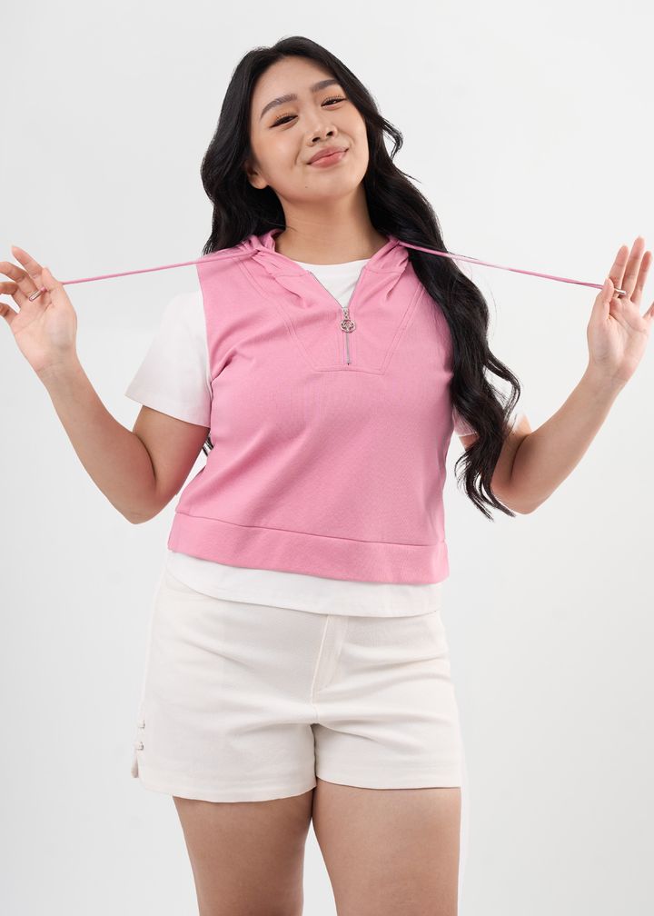 Pink cropped hoodie layered over white tee – playful and casual plus size look