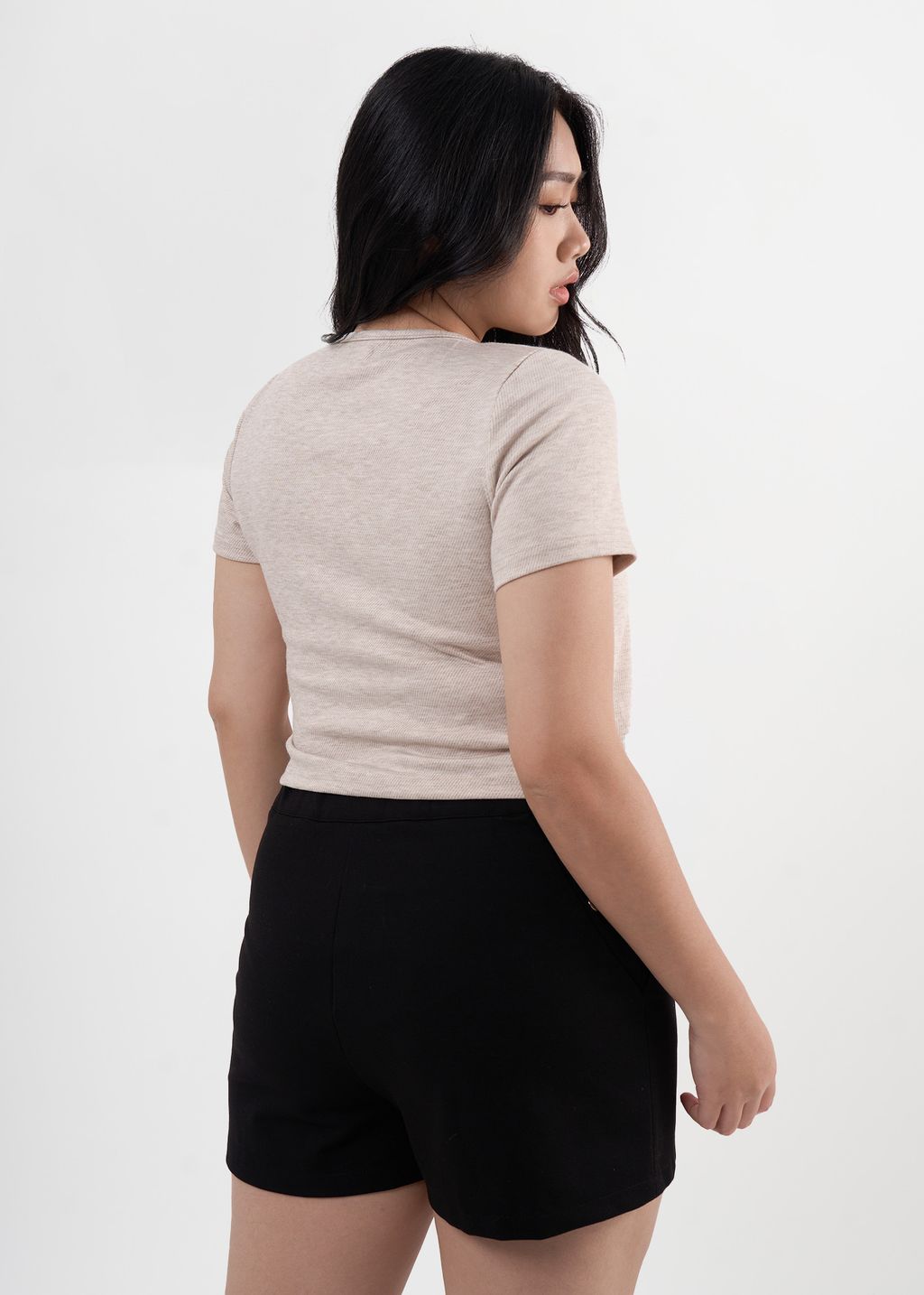 Retro-inspired light beige cardigan with single clasp detail and relaxed fit.