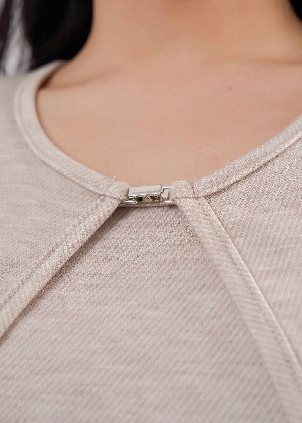 Minimalist cropped cardigan in neutral tones, perfect for curvy layering looks.