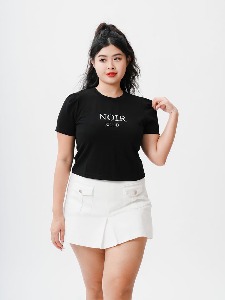 Plus-size black graphic tee with “NOIR CLUB” text and a clean cropped cut.