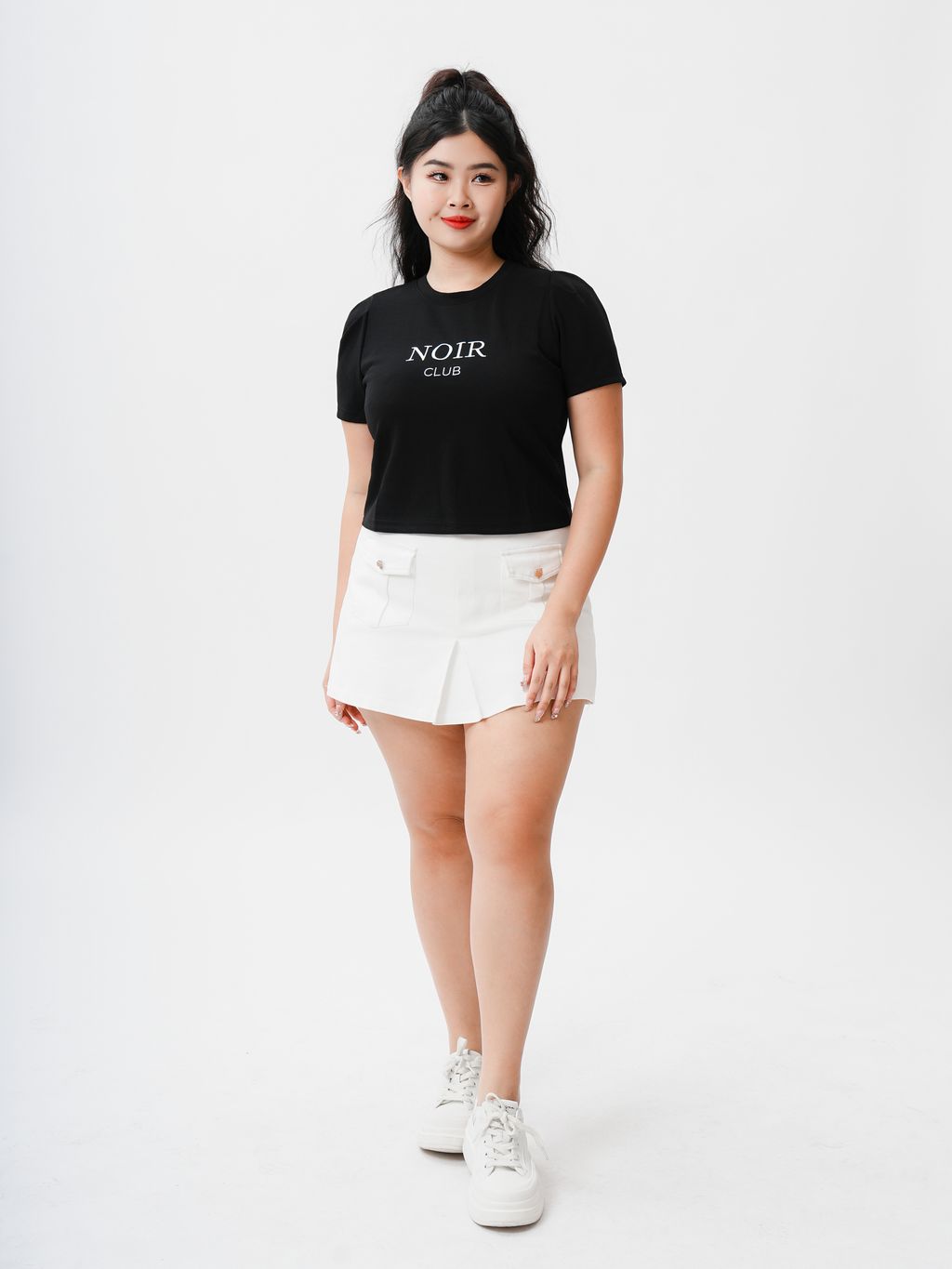 Chic black round neck T-shirt with bold white lettering for a modern look.