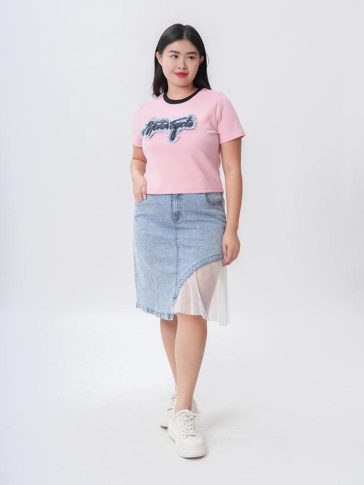 Trendy plus-size graphic tee designed with vibrant elements for a youthful look.