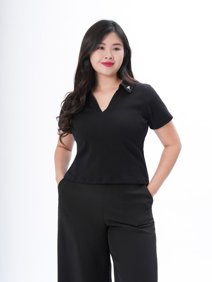 Trendy cropped polo shirt designed to flatter plus-size curves with modern flair.