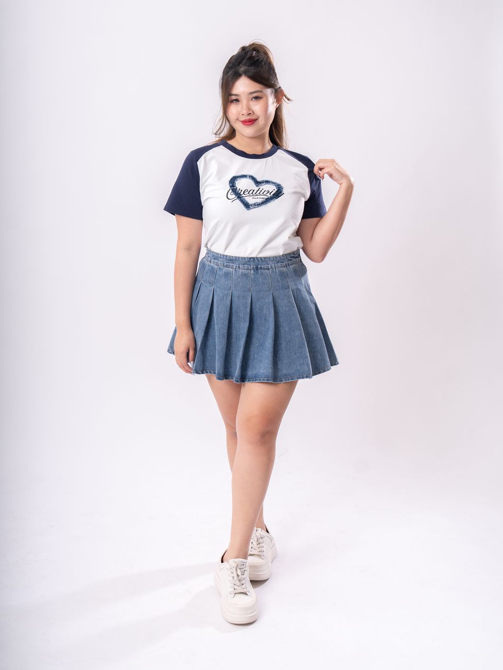 Art-inspired fray heart blouse, flattering for plus size figures with a touch of whimsy.