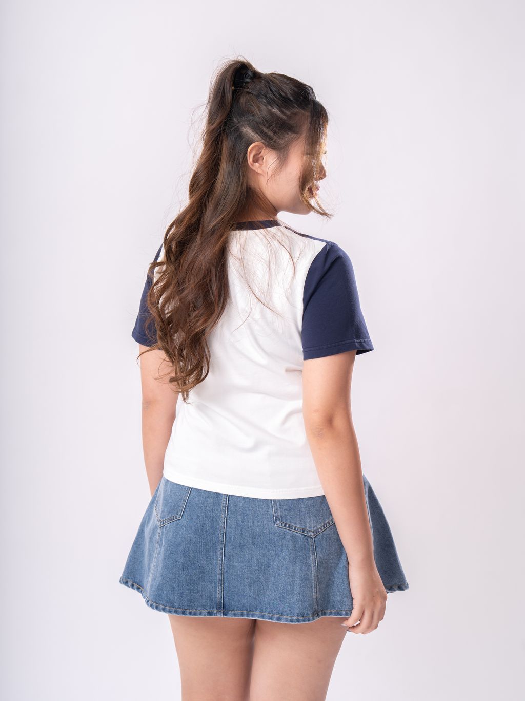 Loose-fit plus size top featuring a frayed heart patch for an artsy, modern twist.